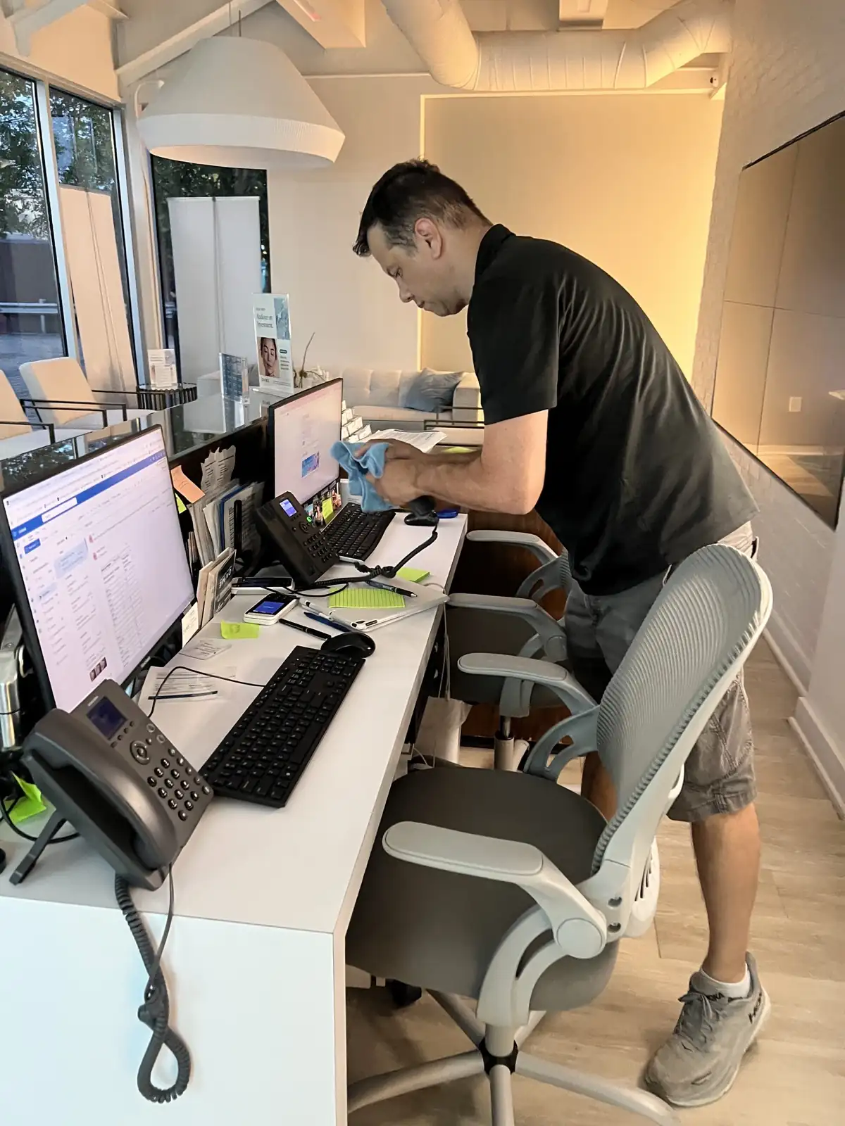 Top Vision crew cleaning an office reception desk in Atlanta